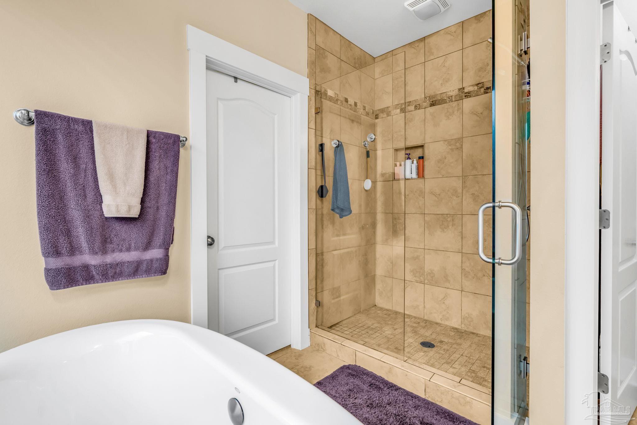 8606 Foxtail Loop Pensacola, FL 32526 - Photo 28 of 57 a bathroom with a shower and a sink