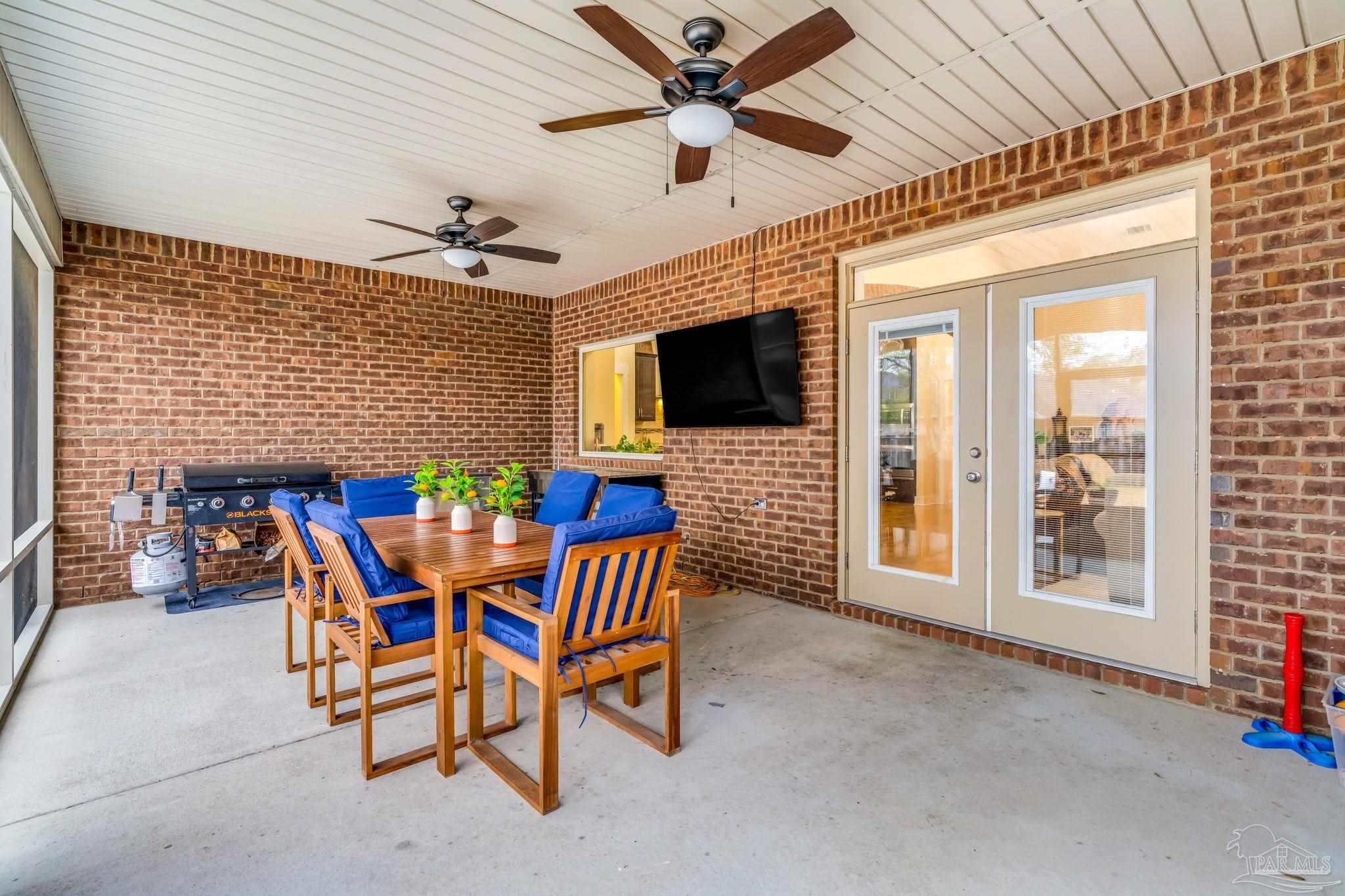 8606 Foxtail Loop Pensacola, FL 32526 - Photo 32 of 57 a view of a livingroom with furniture and a flat screen tv