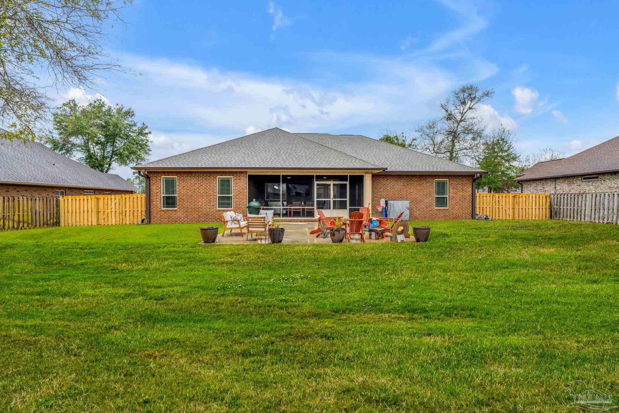 8606 Foxtail Loop Pensacola, FL 32526 - Photo 37 of 57 a front view of a house with garden