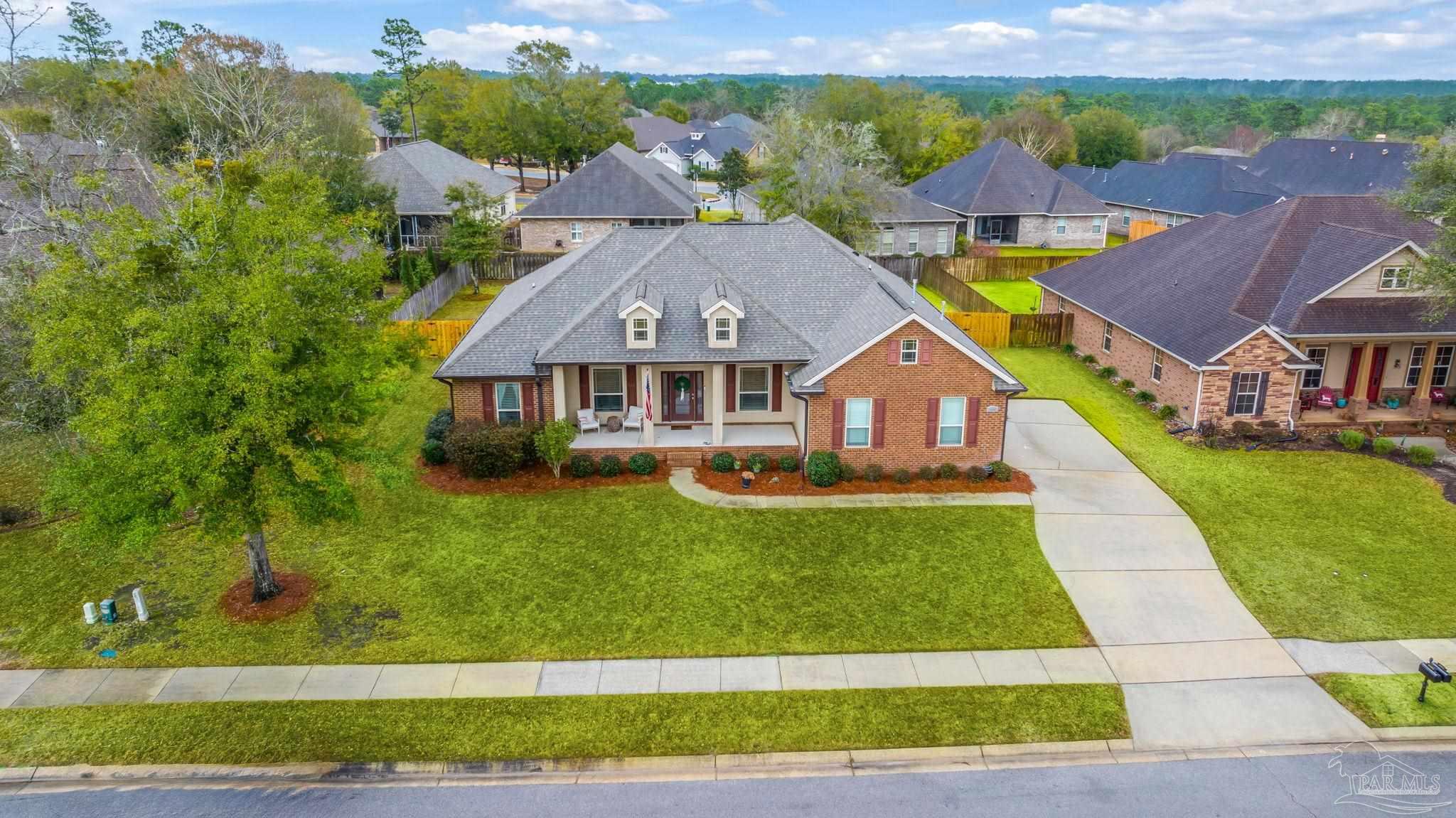 8606 Foxtail Loop Pensacola, FL 32526 - Photo 42 of 57 an aerial view of a house with a garden