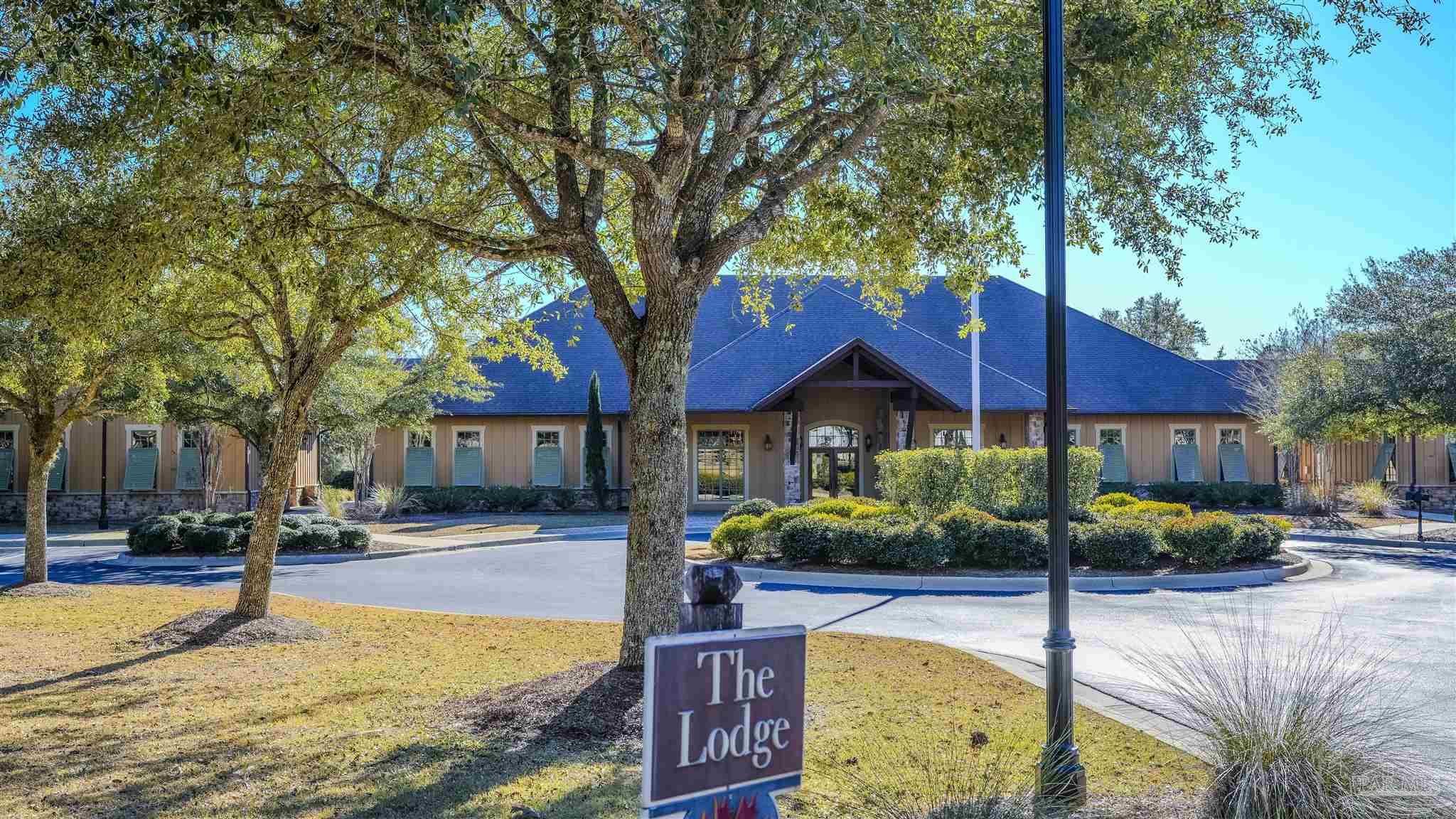 8606 Foxtail Loop Pensacola, FL 32526 - Photo 49 of 57 a view of a house with swimming pool