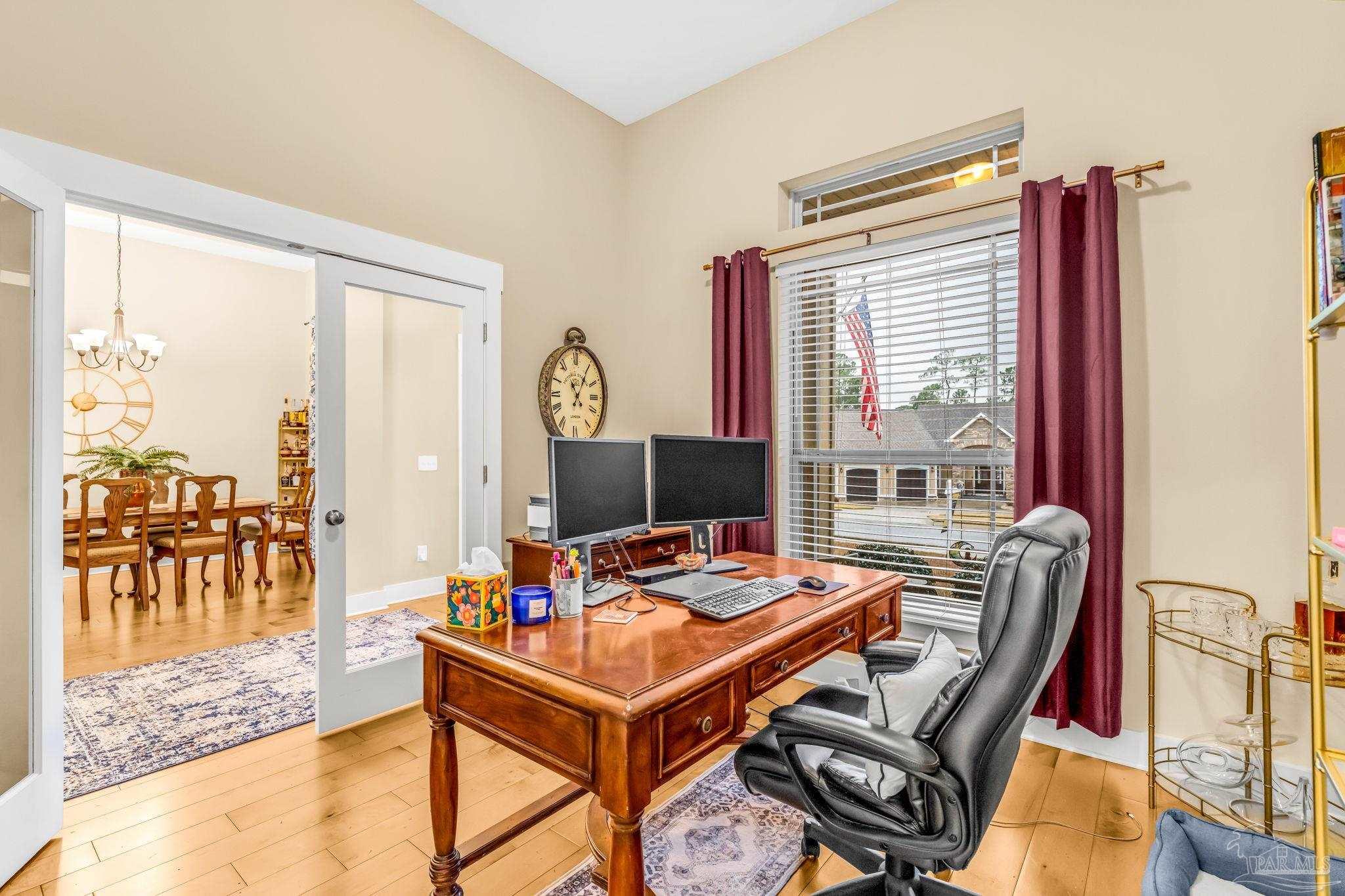 8606 Foxtail Loop Pensacola, FL 32526 - Photo 5 of 57 a room with furniture and a floor to ceiling window