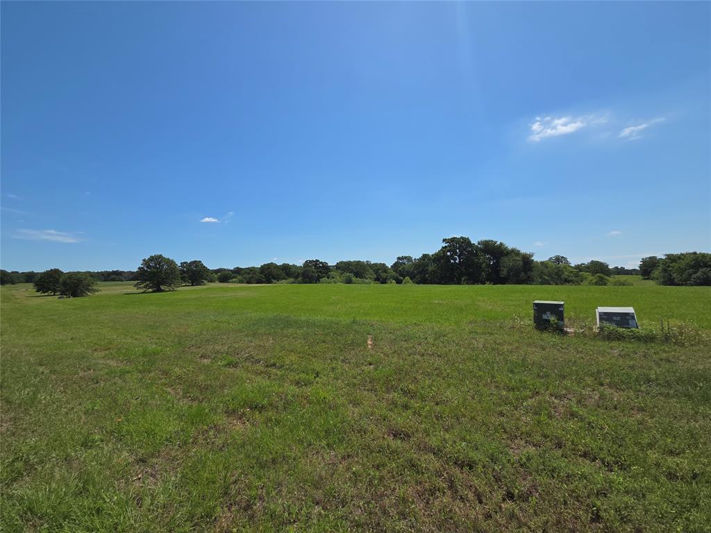 Lot 100 Lake Ridge Drive Streetman, TX 75859 - Photo 20 of 38 a view of a lake with a yard