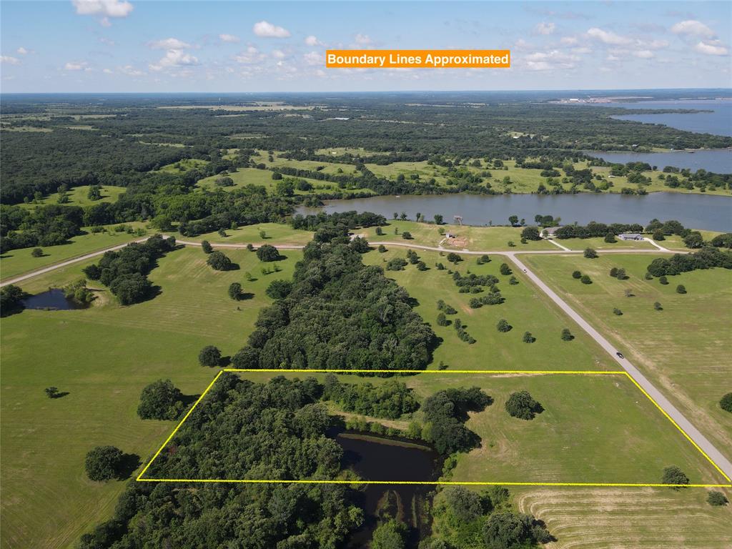 Lot 100 Lake Ridge Drive Streetman, TX 75859 - Photo 32 of 38 an aerial view of ocean and residential houses with outdoor space