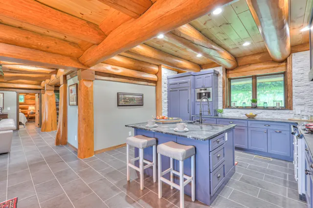 a kitchen with a stove a sink and a refrigerator