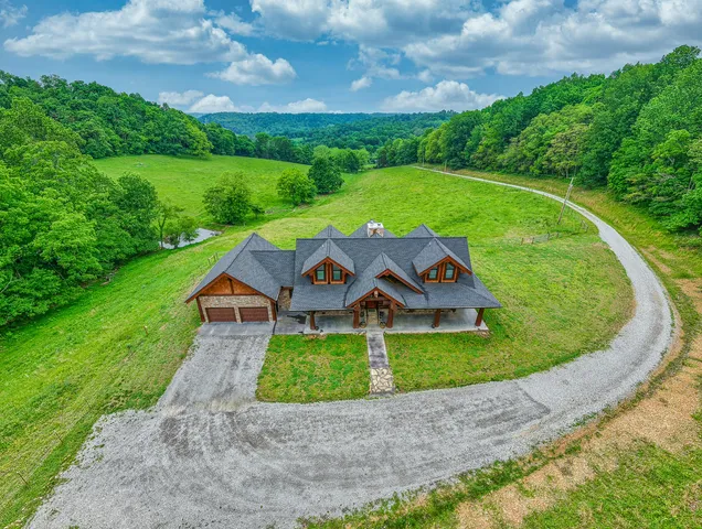a view of a lush green space with sea
