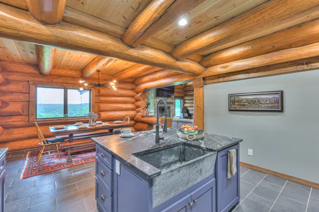 a utility room with granite countertop cabinets washer and dryer