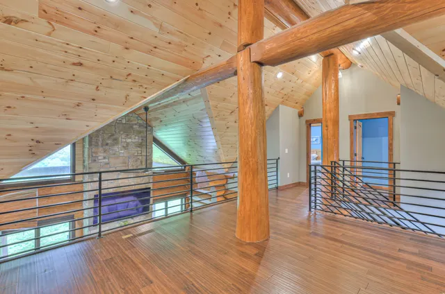 a workspace room with furniture and windows