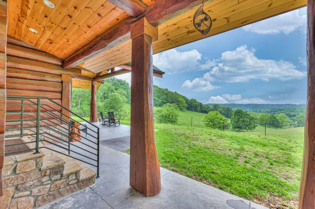 a wooden bench sitting in backyard of a house