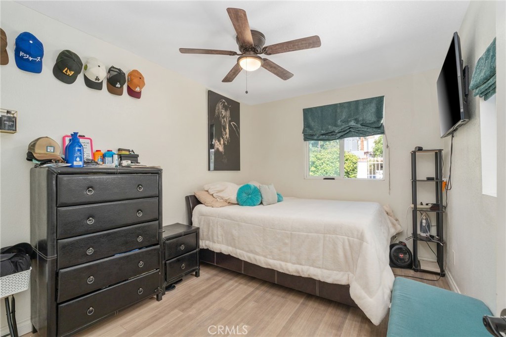 411 South Hewes Street Orange, CA 92869 - Photo 13 of 37 a bedroom with a bed and a flat screen tv