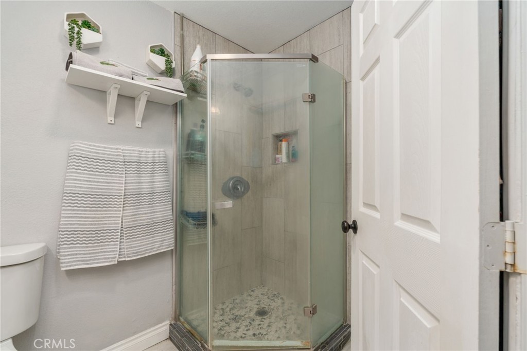 411 South Hewes Street Orange, CA 92869 - Photo 16 of 37 a bathroom with a shower and a sink