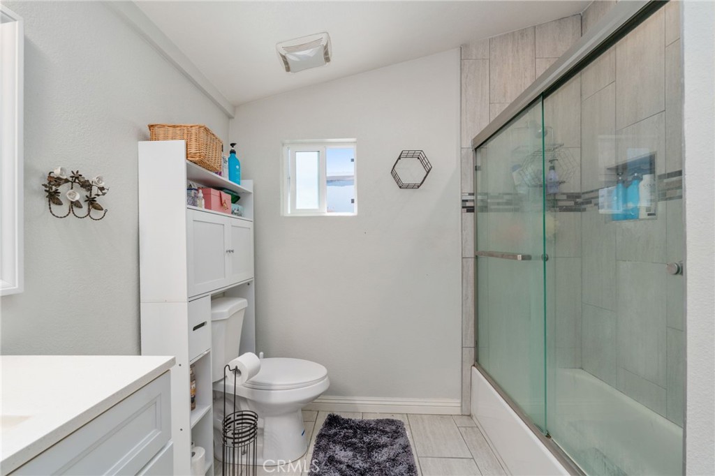 411 South Hewes Street Orange, CA 92869 - Photo 22 of 37 a bathroom with a sink a toilet and shower