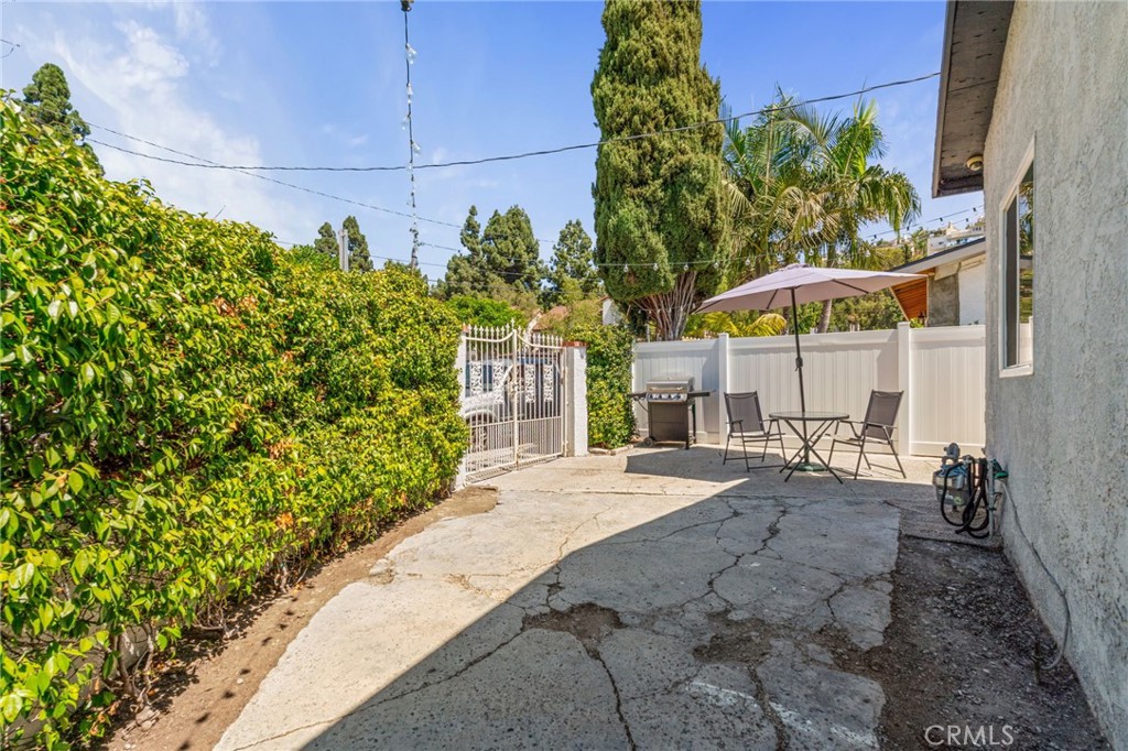 411 South Hewes Street Orange, CA 92869 - Photo 25 of 37 a view of a backyard with a patio
