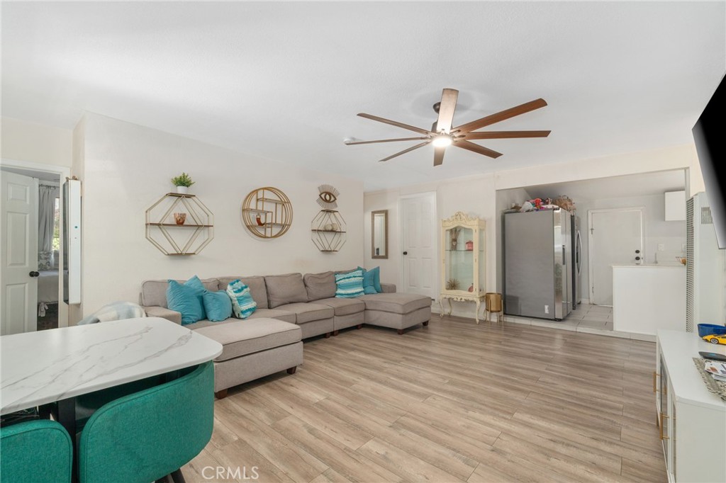 411 South Hewes Street Orange, CA 92869 - Photo 3 of 37 a living room with furniture and a large window
