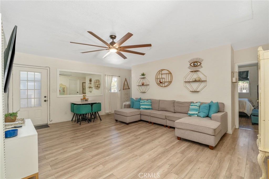 411 South Hewes Street Orange, CA 92869 - Photo 6 of 37 a living room with furniture and wooden floor