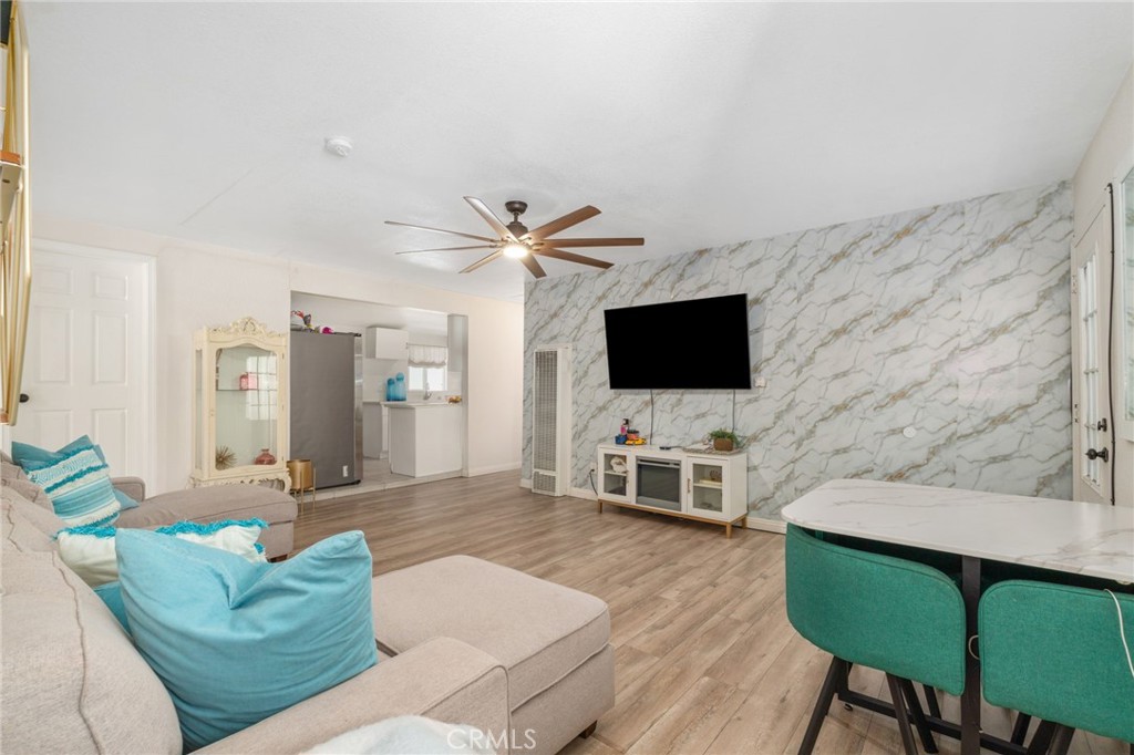 411 South Hewes Street Orange, CA 92869 - Photo 8 of 37 a living room with furniture and a flat screen tv