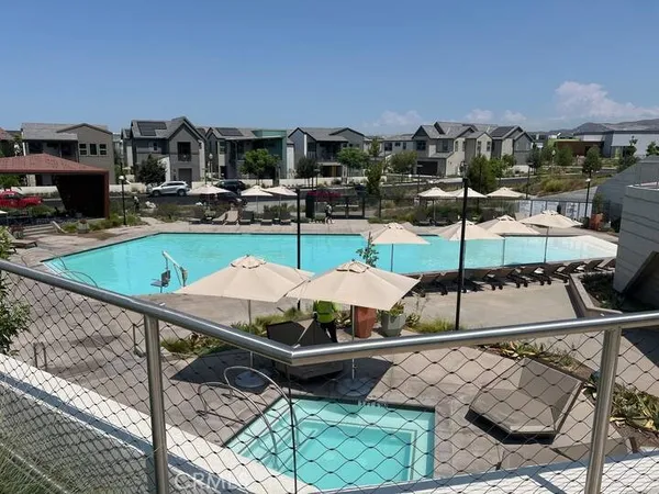 a terrace with outdoor seating and city view