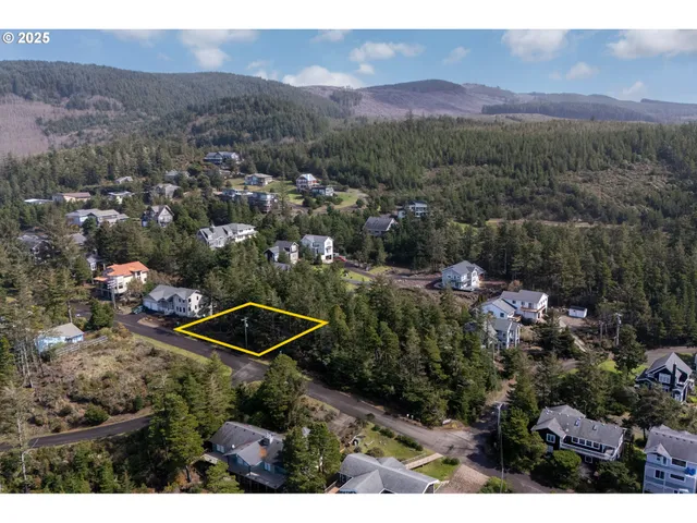 an aerial view of a house with a garden