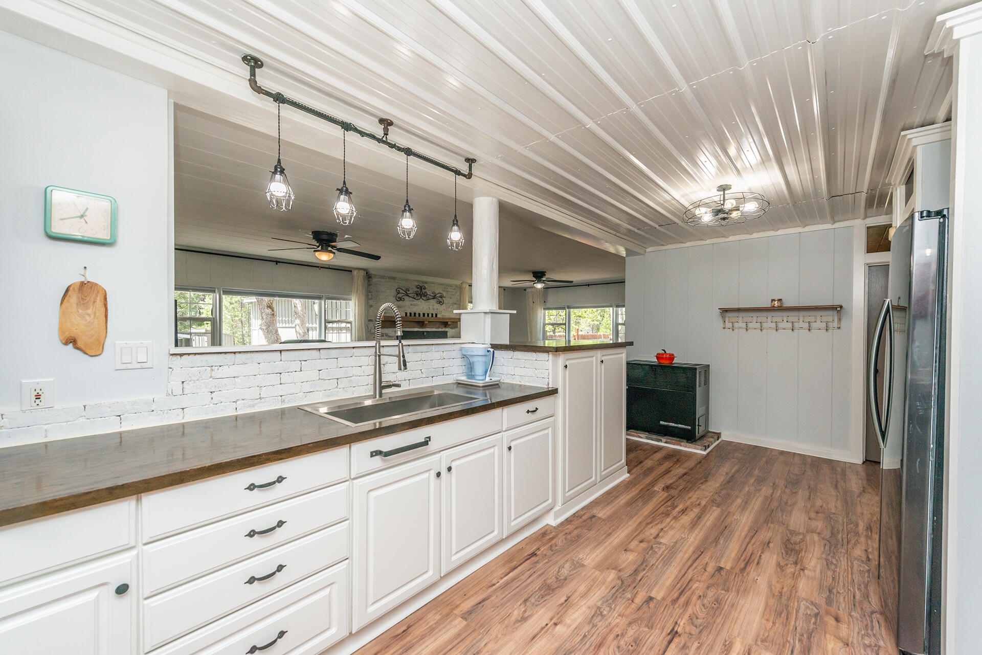 881 East Fork Road Trinity Center, CA 96091 - Photo 23 of 75 a kitchen with granite countertop a stove a sink and a refrigerator