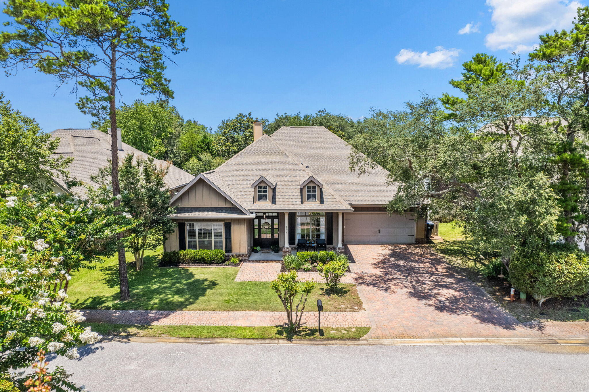 134 Mussett Bayou Court Santa Rosa Beach, FL 32459 - Photo 1 of 41 a front view of a house with a yard