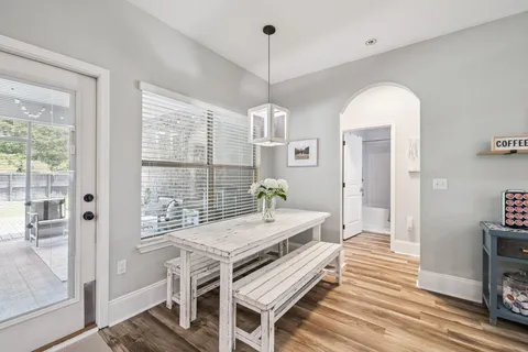 a very nice looking room with a large window and furniture