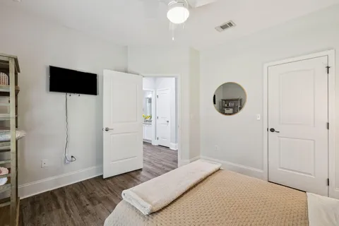 a bedroom with a bed and a television