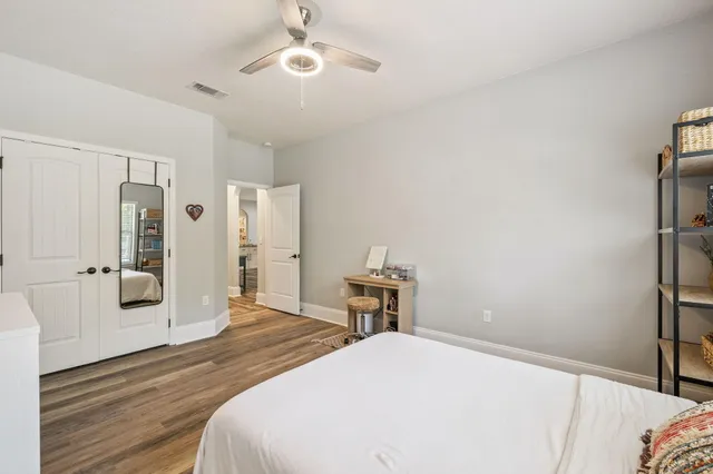 a bedroom with a bed and a view of bathroom