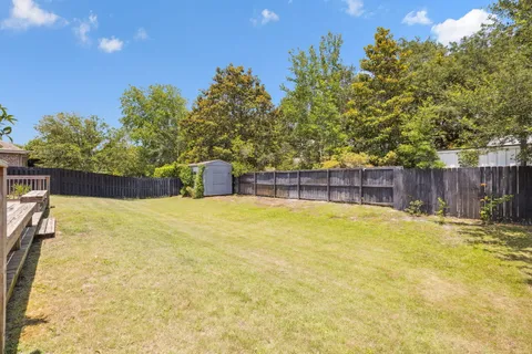 a swimming pool with wooden fence