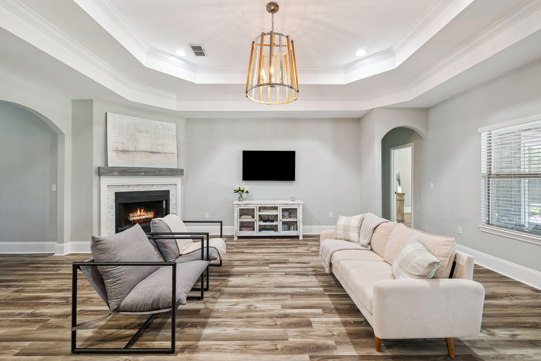 134 Mussett Bayou Court Santa Rosa Beach, FL 32459 - Photo 8 of 41 a living room with furniture a flat screen tv and a fireplace