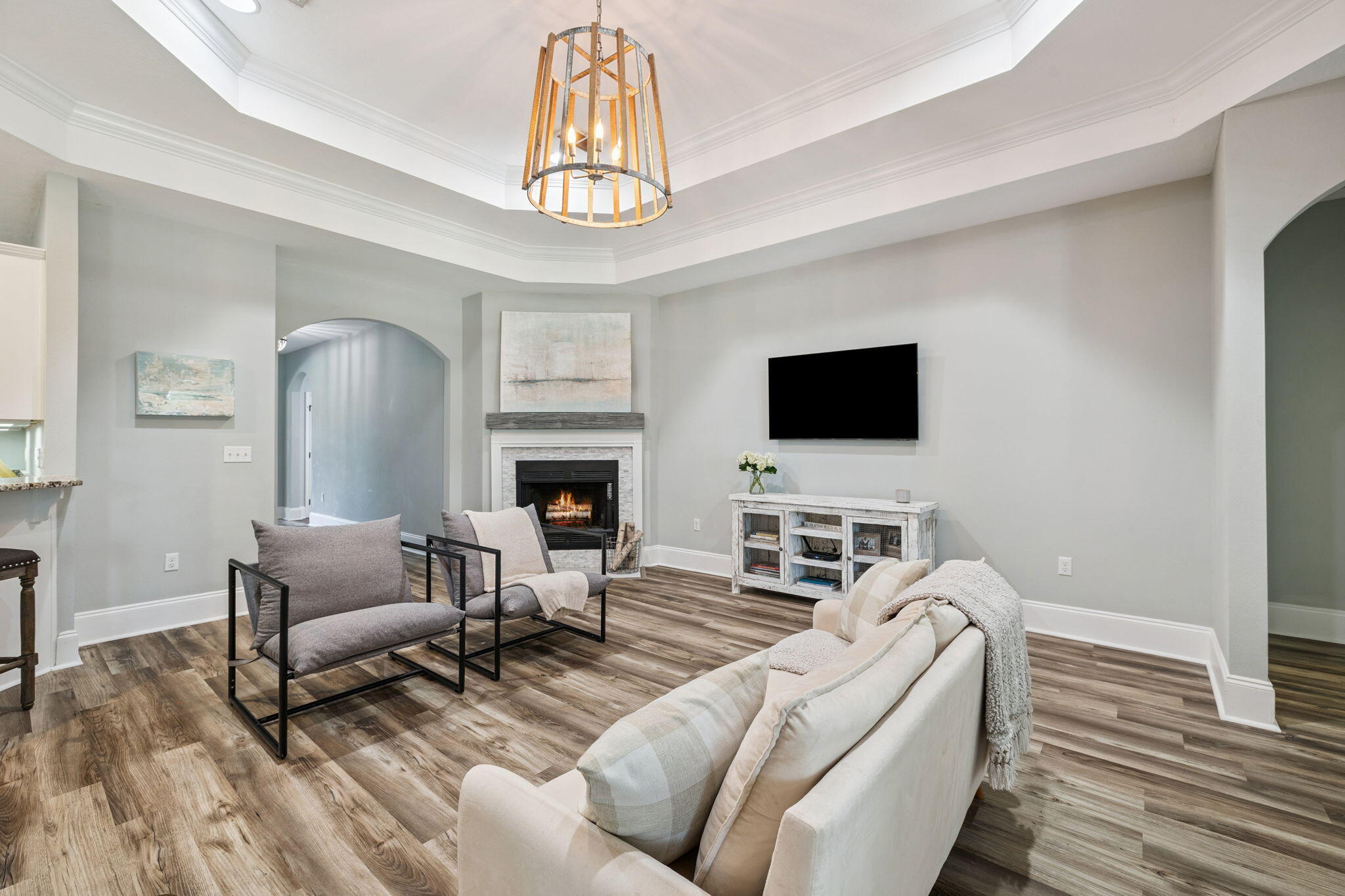 134 Mussett Bayou Court Santa Rosa Beach, FL 32459 - Photo 9 of 41 a living room with furniture a flat screen tv and a fireplace