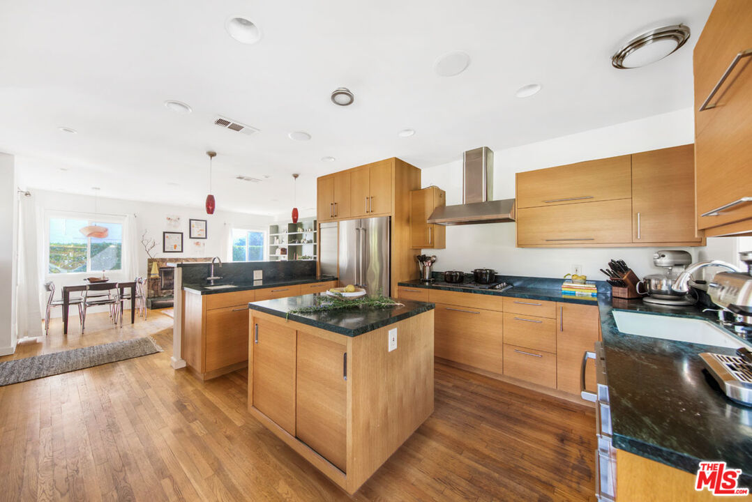 1715 Sinaloa Avenue Pasadena, CA 91104 - Photo 11 of 33 a kitchen with stainless steel appliances granite countertop a stove and cabinets