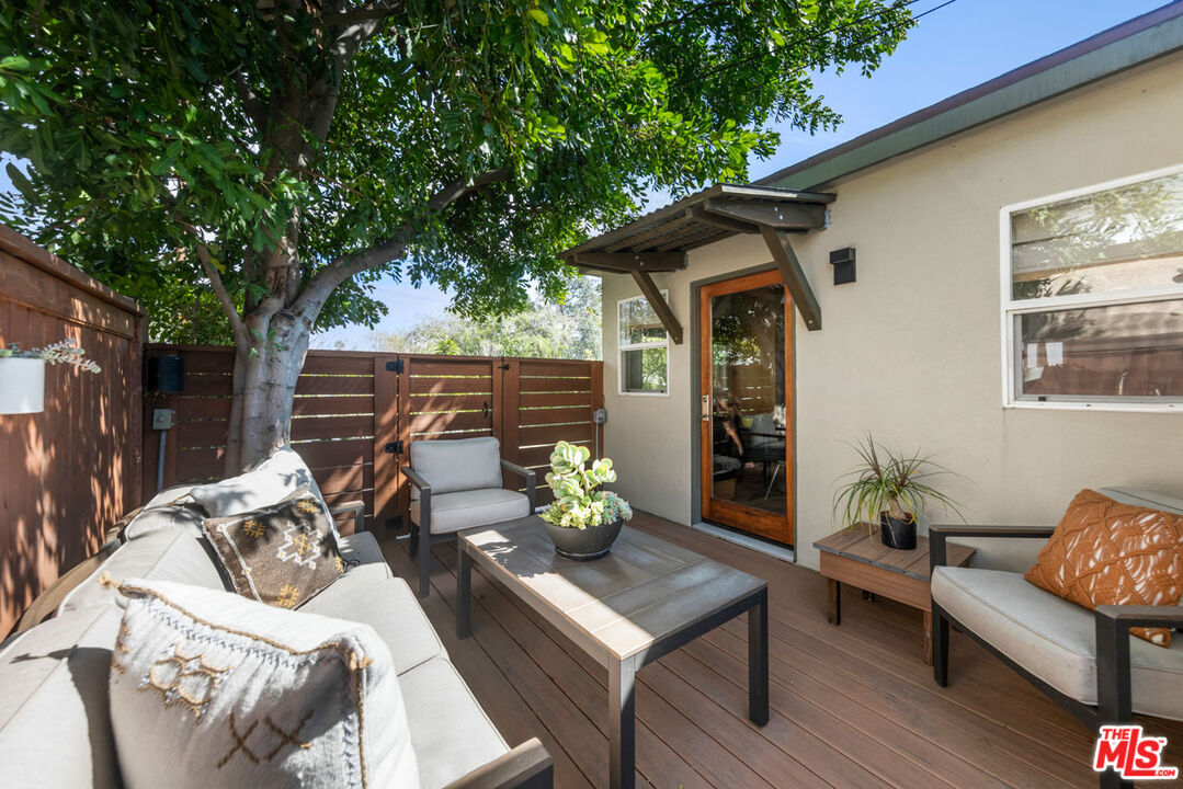 1715 Sinaloa Avenue Pasadena, CA 91104 - Photo 15 of 33 a view of a patio with couches table and chairs and potted plants