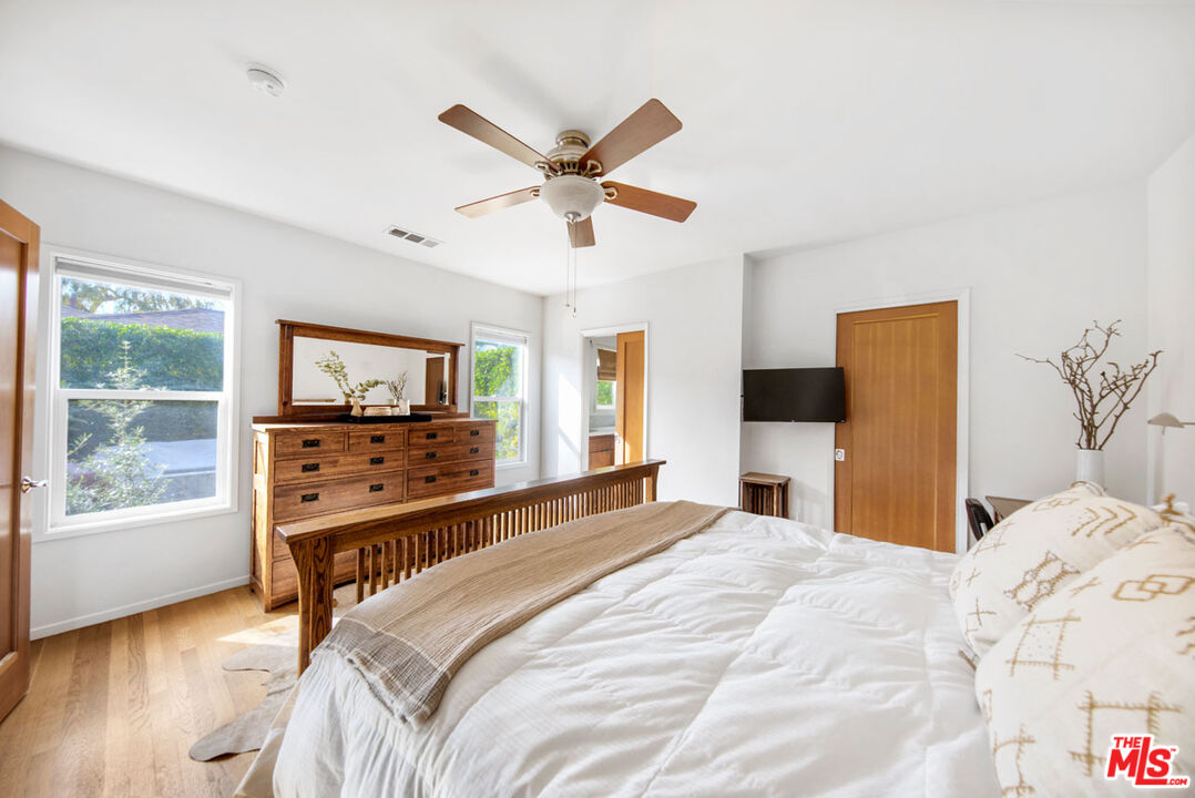 1715 Sinaloa Avenue Pasadena, CA 91104 - Photo 17 of 33 a bedroom with a bed and a flat screen tv