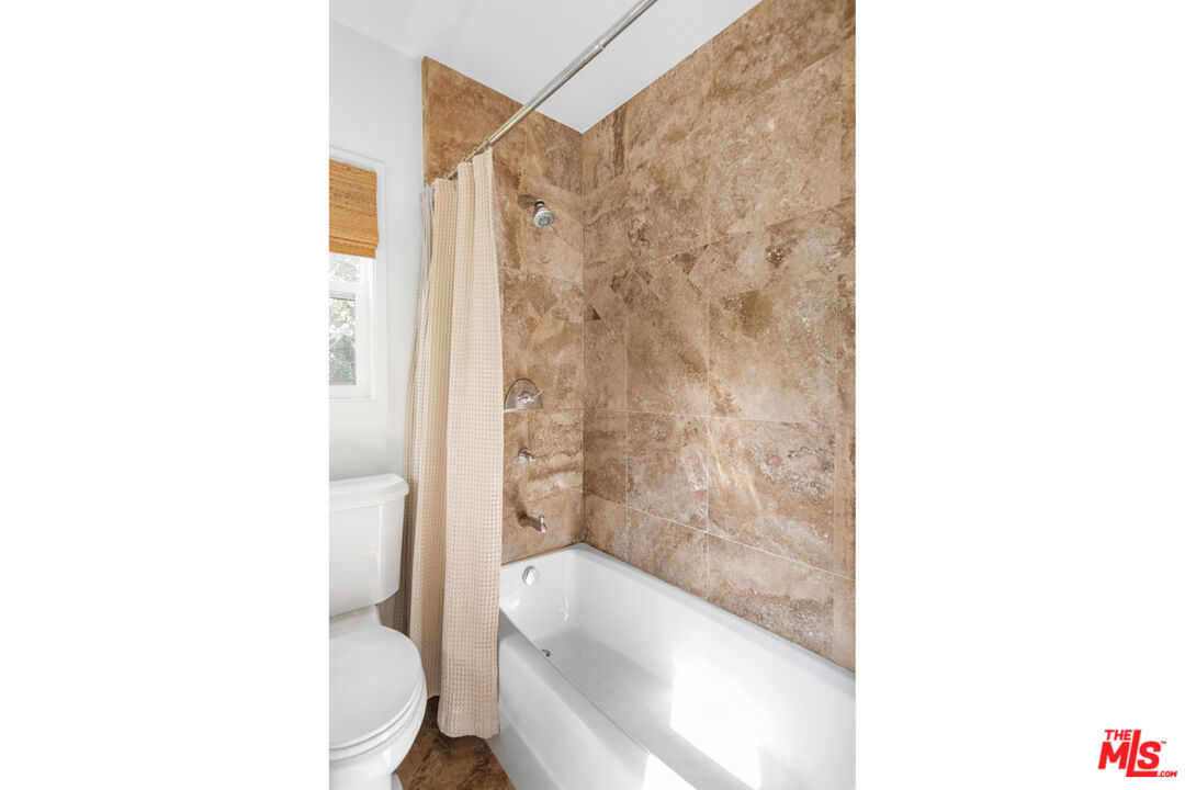 1715 Sinaloa Avenue Pasadena, CA 91104 - Photo 19 of 33 a bathroom with a sink a toilet and shower