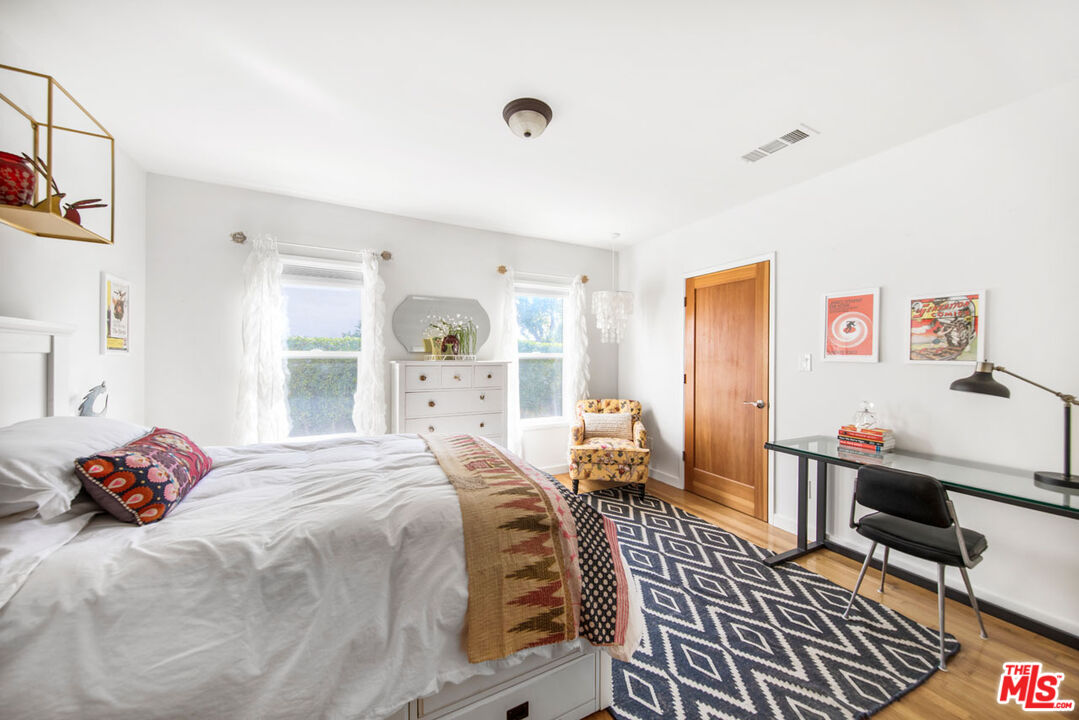 1715 Sinaloa Avenue Pasadena, CA 91104 - Photo 21 of 33 a bedroom with a bed and wooden floor