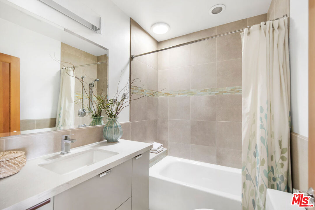 1715 Sinaloa Avenue Pasadena, CA 91104 - Photo 22 of 33 a bathroom with a granite countertop sink and a bathtub