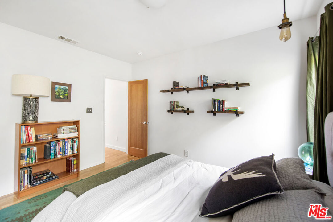 1715 Sinaloa Avenue Pasadena, CA 91104 - Photo 24 of 33 a bedroom with a bed and a couch