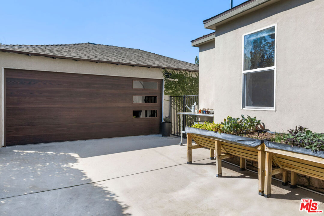 1715 Sinaloa Avenue Pasadena, CA 91104 - Photo 31 of 33 a wooden bench sitting in front of a building