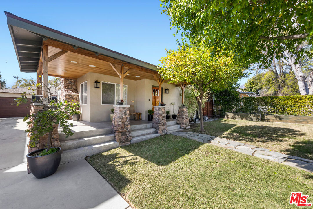 1715 Sinaloa Avenue Pasadena, CA 91104 - Photo 4 of 33 a view of a patio with couches and potted plants