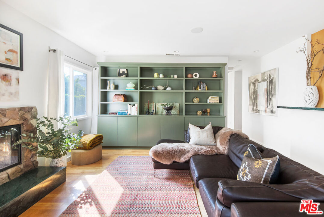 1715 Sinaloa Avenue Pasadena, CA 91104 - Photo 6 of 33 a living room with furniture and painting on the wall