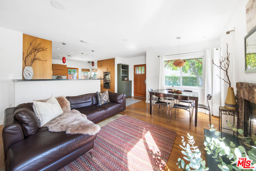 1715 Sinaloa Avenue Pasadena, CA 91104 - Photo 7 of 33 a living room with furniture and a flat screen tv