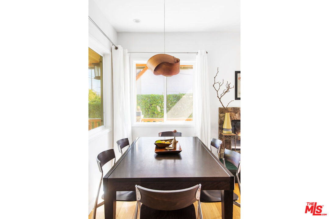 1715 Sinaloa Avenue Pasadena, CA 91104 - Photo 8 of 33 a view of a dining room with a table and a potted plant