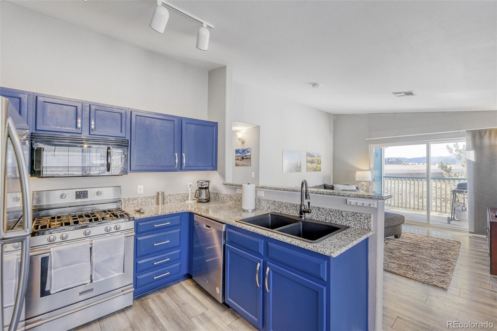 8425 Pebble Creek Way, Unit 201 Highlands Ranch, CO 80126 - Photo 2 of 12