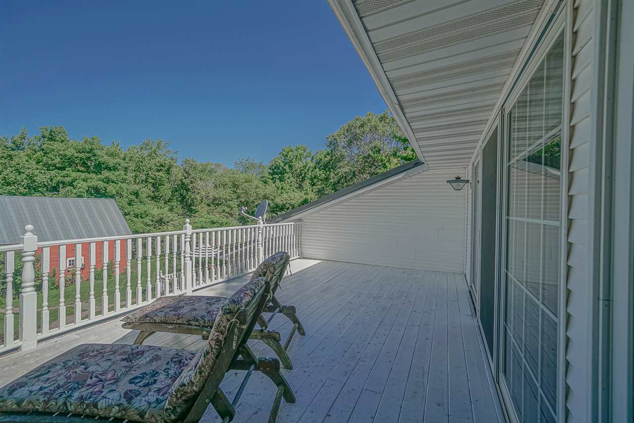 1907 Maples Road Dixon, IL 61021 - Photo 19 of 25 a balcony with wooden floor