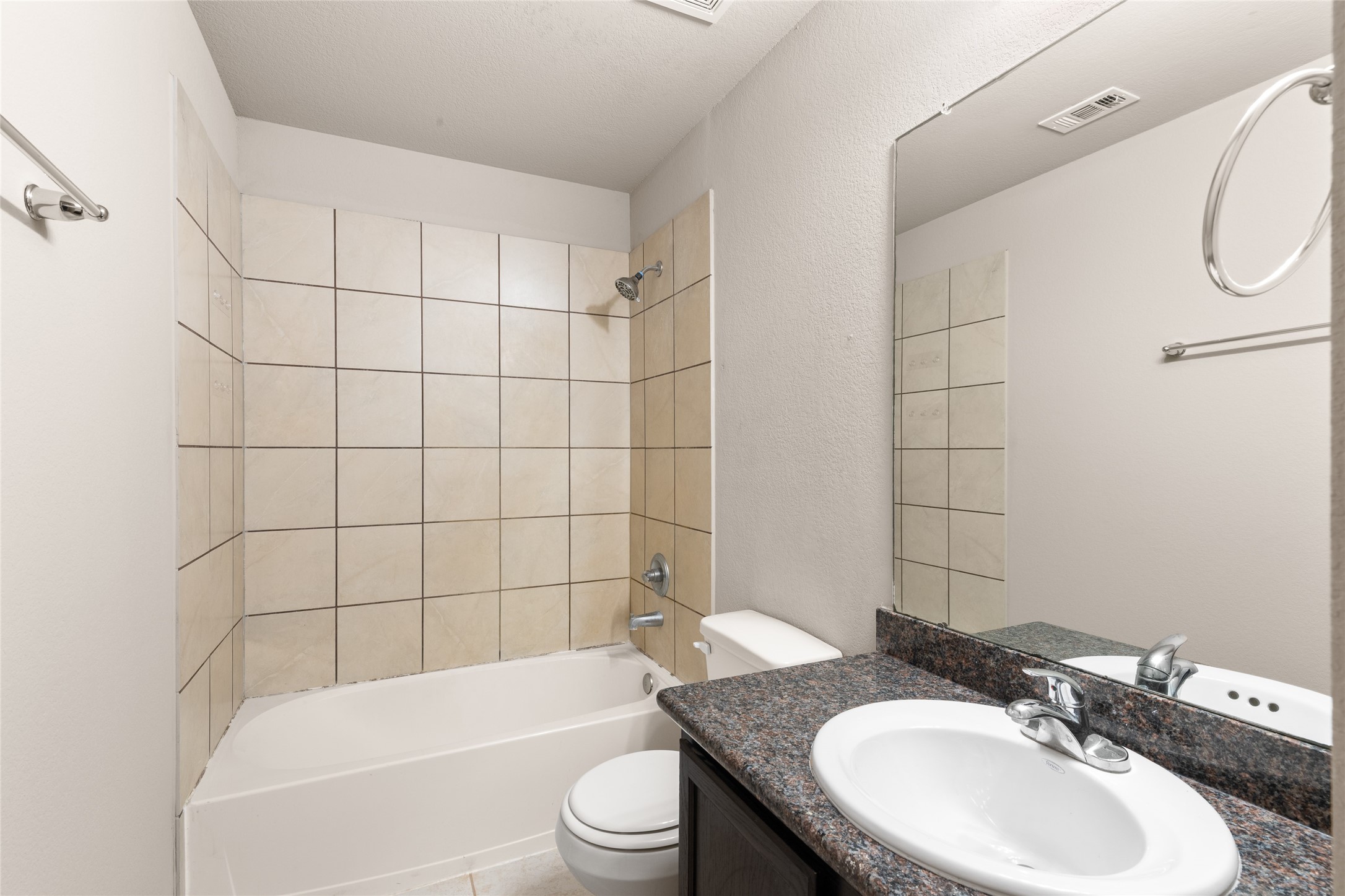 16630 East Hammon Montgomery, TX 77316 - Photo 13 of 14 a bathroom with a granite countertop bathtub sink vanity mirror and toilet