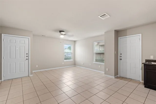 a view of an empty room and window