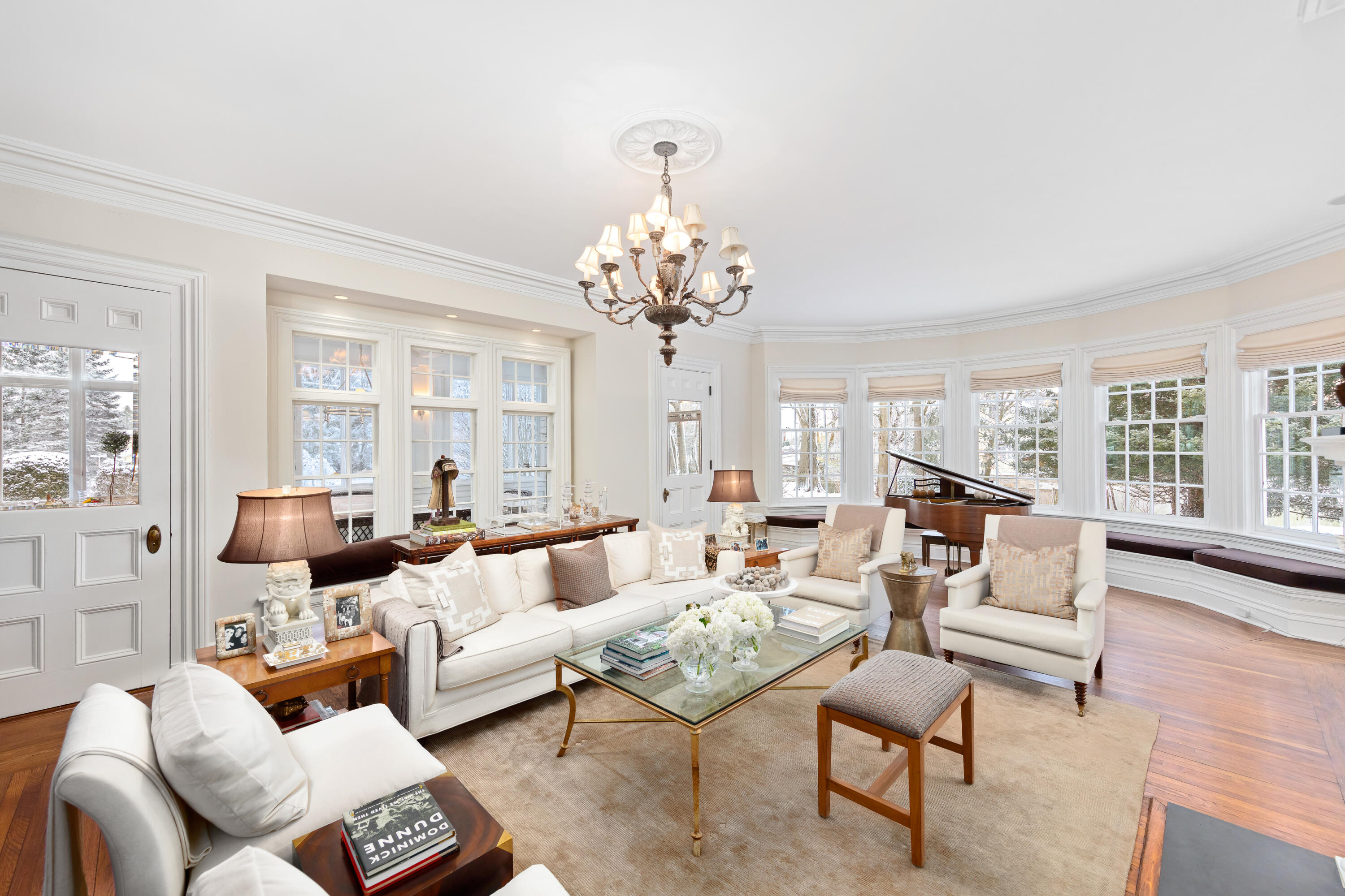 5 Middlesex Road Darien, CT 06820 - Photo 19 of 57 a living room with furniture and a chandelier