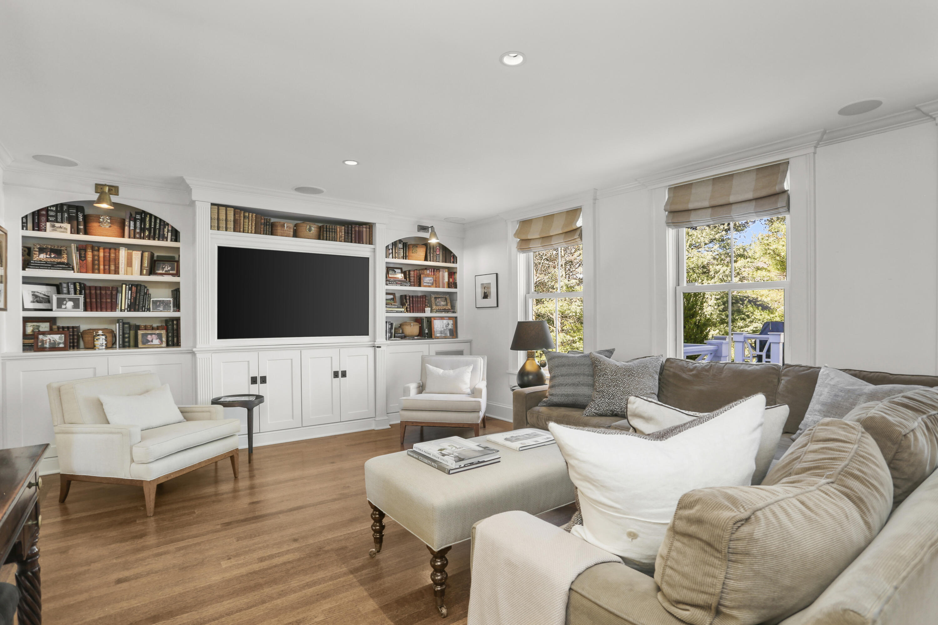 5 Middlesex Road Darien, CT 06820 - Photo 22 of 57 a living room with furniture a flat screen tv and a window