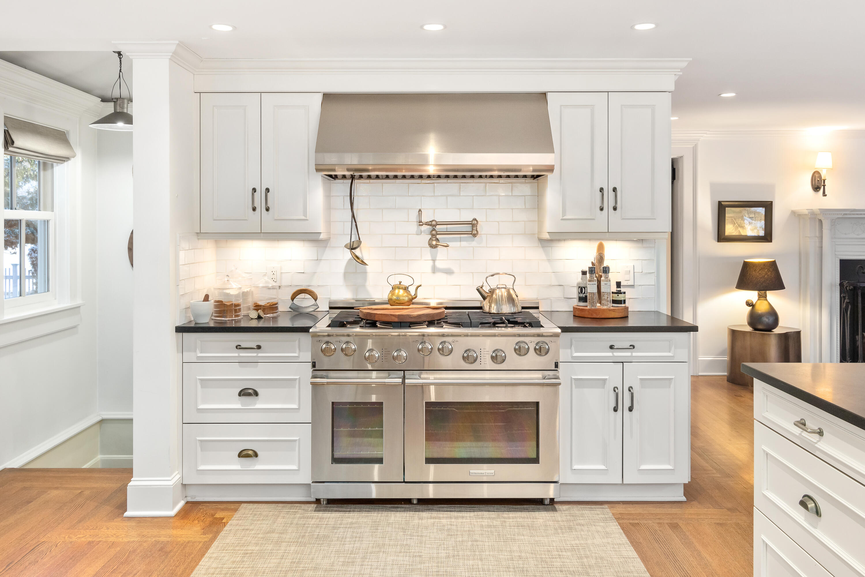 5 Middlesex Road Darien, CT 06820 - Photo 31 of 57 a kitchen with granite countertop white cabinets and white appliances