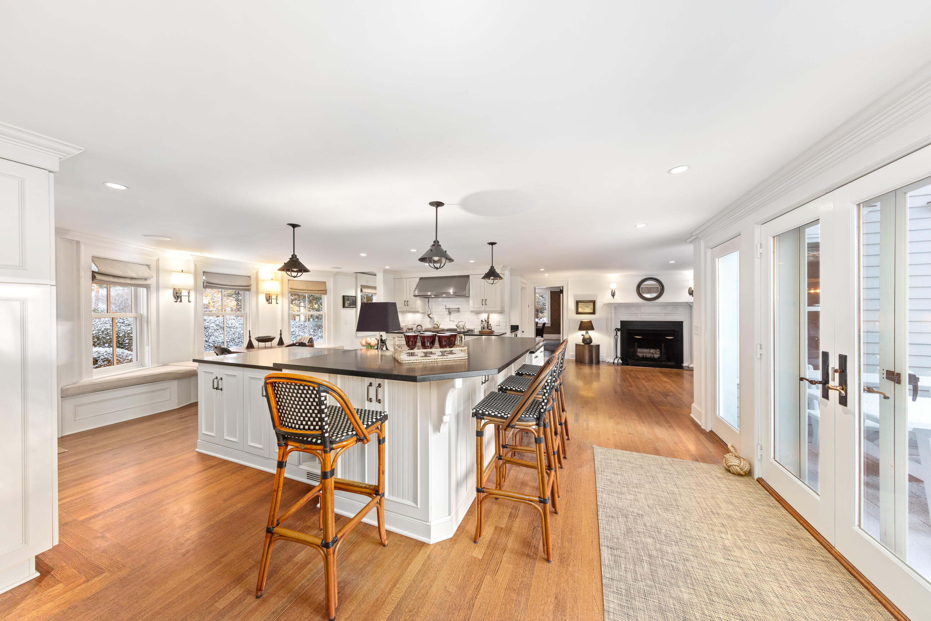 5 Middlesex Road Darien, CT 06820 - Photo 32 of 57 a dining hall with stainless steel appliances a table and chairs with wooden floor